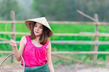 Portrait of beautiful asian woman wear countryside dress of thai at the field,Thailand people