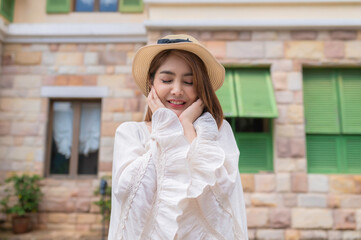 Asian woman traveling at the old town italy style,Alone travel,Lifestyle of single girl,View mountain with fog