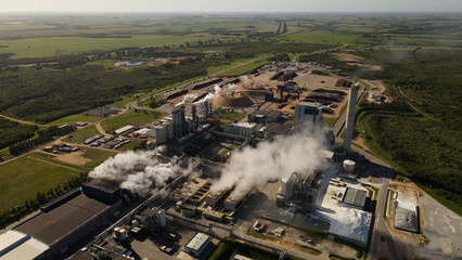Toxic Smoke rising up from chimneys of industrial factory in Uruguay,South America. Environmental...