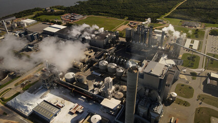 A dynamic aerial footage tilting downward towards the UPM Fray Bentos pulp mill factory located on...