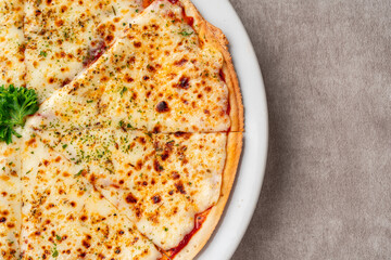 cheesy pizza slice. Pizza is a savory dish of Italian origin, consisting of a usually round.