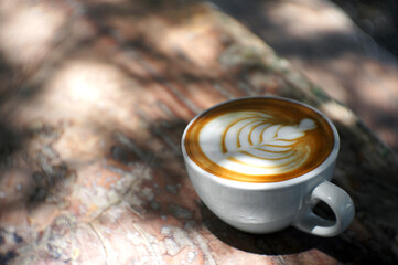 cup of Hot cappuccino coffee on table