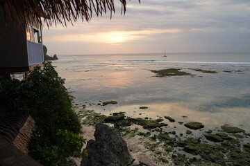 Beach sunset on a cliff in Uluwatu, Bali
