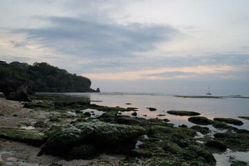 Beach sunset on a cliff in Uluwatu, Bali