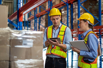 worker person working with safety in warehouse logistic factory, business manufacturing industry occupation concept, goods product box distribution. Storehouse employee in uniform. warehouse worker.