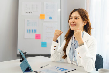 Successful business concept, Businesswoman raising arms to celebrate when success from new project