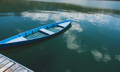 The blue boat on Plav lake (Prokletije, Montenegro).