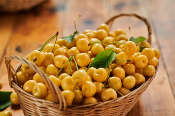 Ripe cherries in a wicker basket