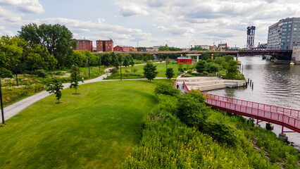 establishing aerial drone footage of  Chicago downtown near the park. the skyscrapers can be seen in the background as the clouds and sky are clear beautiful 