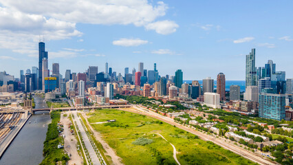 Fototapeta na wymiar establishing aerial drone footage of Chicago downtown near the park. the skyscrapers can be seen in the background as the clouds and sky are clear beautiful 