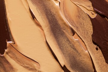 Foundation or bb cc cream and matte concealer texture swatch on beige background