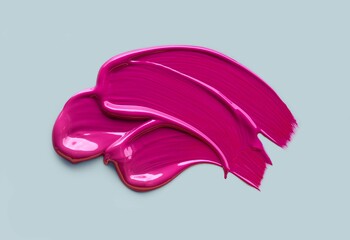 Lip gloss swatch or shimmering cosmetic gel mask sample on gray background