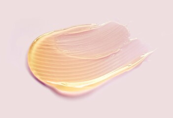 Cosmetic yellow gold shimmering oil gel pink texture background