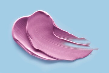 Lipstick liquid abstract strokes smudges background texture berry pink amaranth carnation isolated on blue pastel background