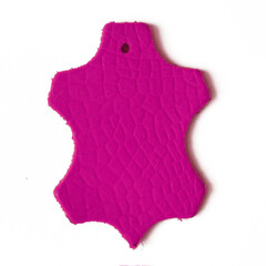 Pink Leather label, samples of natural leather on white background, closeup, top view