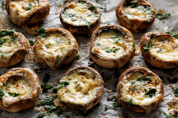 Grilled mushrooms stuffed with cheese and herbs, focus on the mushroom  inside, close up view