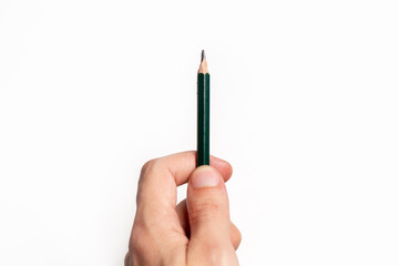 Hand holding a pencil over blank paper