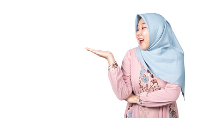 Asian Muslim woman in pink dress is surprised while raising her right hand, female promoter, promotion concept