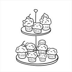 Two-tier serving tray with cupcakes. Plate with sweet dessert.