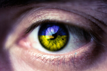 human gas close-up, Ukraine flag color pupil, crisis in Ukraine and war