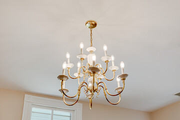 brass gold chandelier on the ceiling historic design vintage antique light fixture - obrazy, fototapety, plakaty