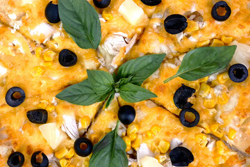 Homemade pizza with cheese, chicken meat, olives and basil leaves. Tasty unhealthy fast food snack of Mediterranean food. - 520395661