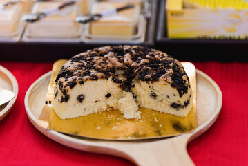 The large cake is divided into pieces so that the inside of the cake is visible.