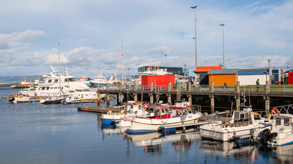 Harbors at Reykjavis, Iceland, with snowy mountains as background, under cloudy day