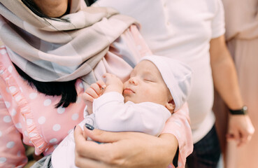 Obraz na płótnie Canvas woman holds sleeping baby tightly arms life