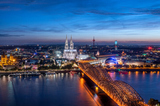 Cologne skyline at night with view of Hohenzollern Bridge and Rhine River, North Rhine-Westphalia, Germany