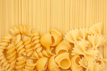 Background of different types of pasta. View from above
