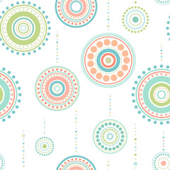 Seamless ethnic pattern of blue, orange and green circles and balls. Kaleidoscope ornament. Mandala wallpaper. Holiday toys print. Christmas light background