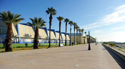 Fototapeta na wymiar Paseo Marítimo y Pabellón Polideportivo Municipal en Puerto Real, provincia de Cádiz, Andalucía, España