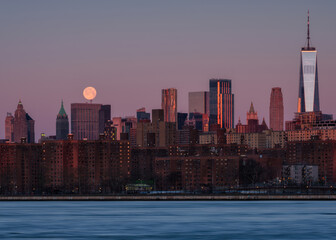 Financial district view with a full moon