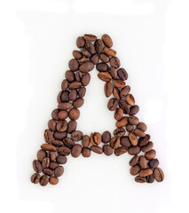 Capital letter A made from coffee beans. Coffee font. Alphabet made from coffee beans. White background. Roasted coffee beans.