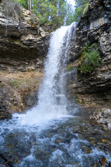 Fototapeta premium Troll Falls waterfall in Kananaskis Country, Alberta Canada in summer