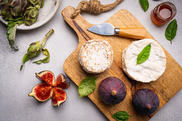 Brie or camembert cheese with figs and honey, top view