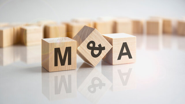 text ma shot form on wooden block