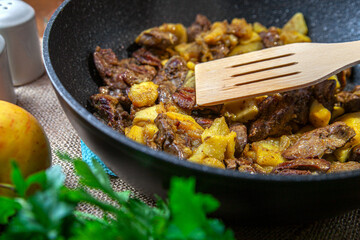 fried meat in a pan