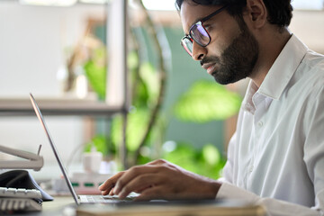 Young busy indian business man office employee worker, arab programmer or company technology...