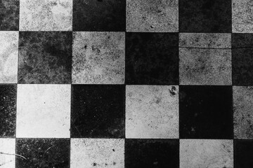Black and white background with a chess board.