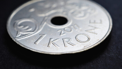 1 Norwegian krone coin close-up. National currency of Norway. Money illustration for news about economy or finance. Bank and loan. Savings and interest. Kroner and Norges Bank. Macro
