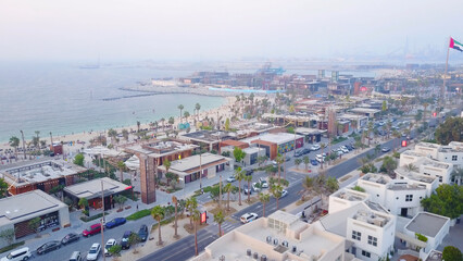 The green oasis. The view from the top of the beach and Arabian Gulf. Top view of beautiful beach coast in Dubai