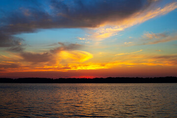 Beautiful sunset on the river with dramatic clouds