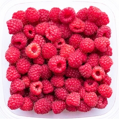Red raspberries in a transparent plastic container, top view