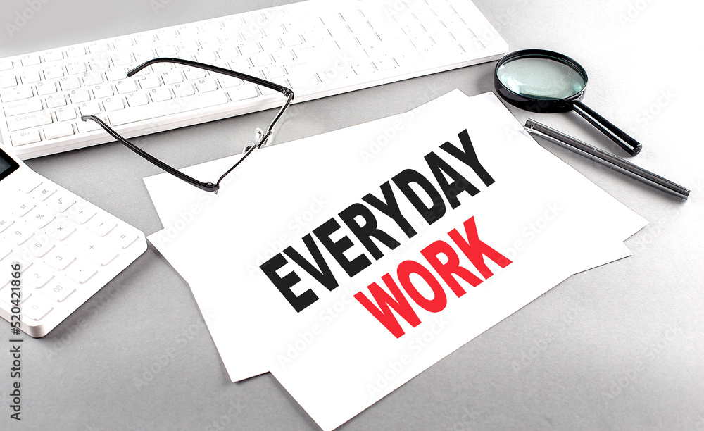 Poster everyday work text on a paper with keyboard, calculator on grey background