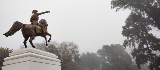 Bahia Blanca-Buenos Aires-Argentina-July, 31, 2022. Monument to the liberator Jose de San Martin riding his horse pointing to the horizon with his finger to the horizon in the mist. ample  (Editorial)