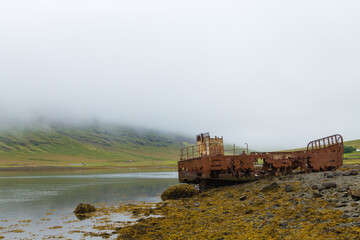 Shipwreck from Mjoifjordur fiord, east Iceland. Icelandic panorama