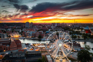 Ferris wheel in Gdansk by the Motlawa River at sunset, Poland