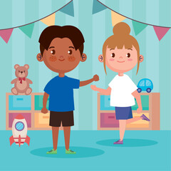 little kids couple in playroom